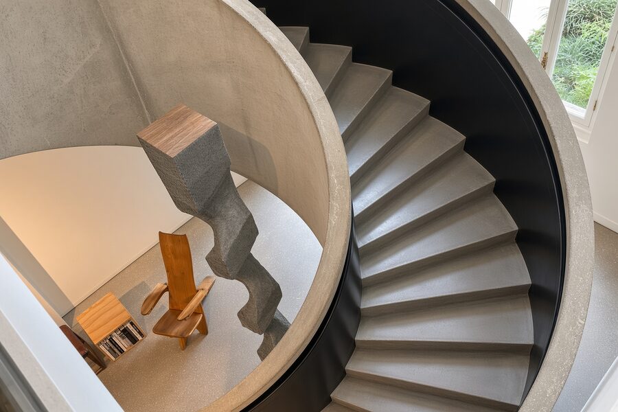 Curved concrete spiral staircase seen from above